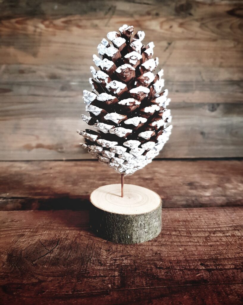 Close-up of decorative christmas tree made of a pine cone.